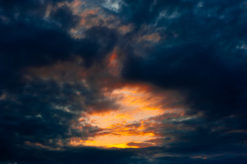 Rays of sun through the clouds at sunset