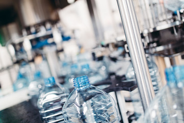 Robotic factory line for processing and bottling of pure spring water into canisters and bottles....