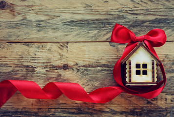 small house with red ribbon