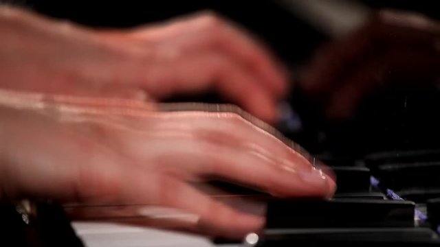Woman Pianist Hands plays The Grand Piano. 