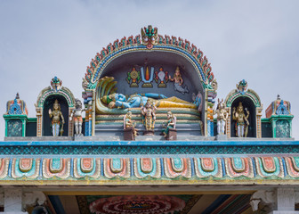 Trichy, India - October 15, 2013: Decoration on entrance hall of Annamandapam. Central image is Ananta Shesha or Ranganatha. Other symbols are Matsya, hayagriva, Bhu Devi, Lakshmi, Dwaralapaka