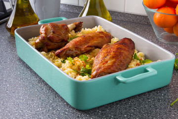 Baked spicy wings of turkey with cheese noodles.