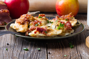 Polish fried dumplings with meat, onion and bacon.