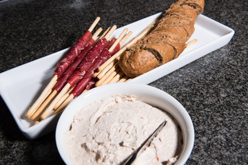 grissini with meat and bread with tuna creme