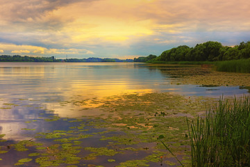 Naklejka premium Beautiful sunset over the river. Central Russia.