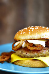 Burger with meat cutlet and caramelized onion.