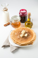 pancakes with butter on a white background