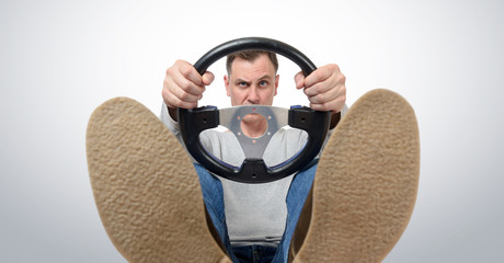 Man with a steering wheel, front view. Driver car concept