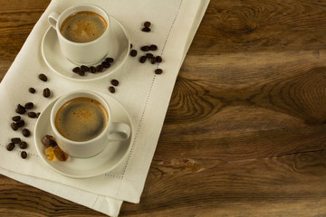 Two cups of coffee on the linen napkin, copy space
