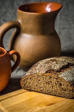 Still life with homemade bread and pottery