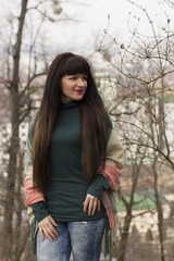 Brunette woman with long hair at the park