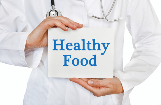 Healthy Food card in hands of Medical Doctor