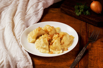 Delicious Ukrainian dumplings with cracklings and fried onion