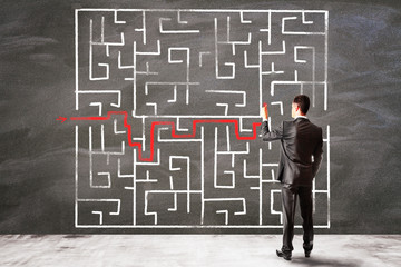 Businessman drawing solution