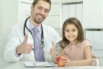 Fototapeta premium male doctor with little girl