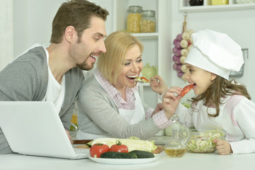 happy family cooking  in kitchen