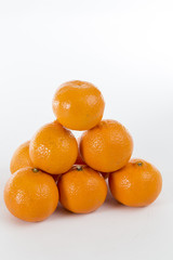 Bright Orange Clementines on a bright background