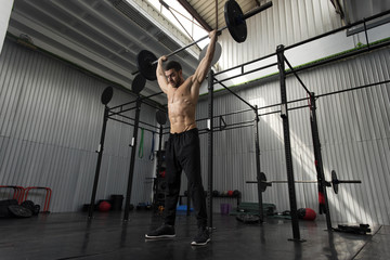 Fototapeta na wymiar Bodybuilder working out in the gym