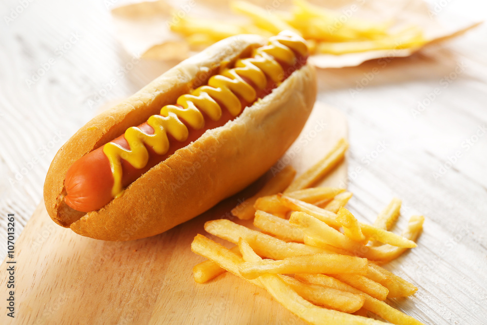 Poster Hot dog with fried potatoes on craft paper