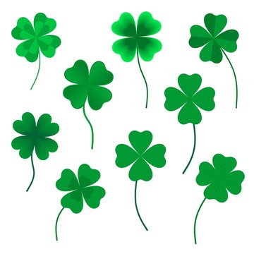Set of green four leaf clovers in various shapes made up of a heart with green stems on a white background