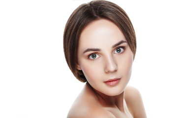 Obraz premium Beauty portrait of pretty girl with natural makeup. Beautiful spa woman touching her face. Perfect fresh skin. Pure beauty model girl. Youth and skin care concept