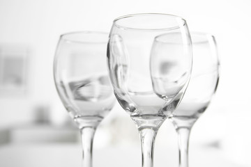 Wineglasses on blurred interior background