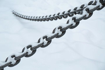Iron chain on snow background
