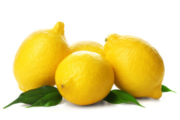 Fresh lemons with green leaves isolated on white