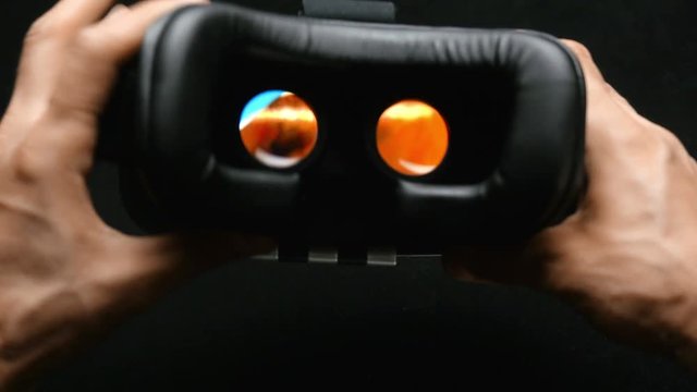 Virtual reality mask. VR.  Male hand taking a virtual reality headset. 