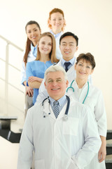 Team of smiling doctors indoors