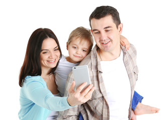 Happy family making selfie with mobile phone isolated on white