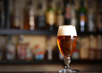 Glass of beer in a bar, close up