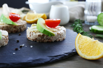 Avocado sandwiches with tomatoes on a mat