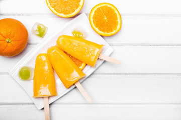 Fototapeta na wymiar Homemade orange ice cream on a stick