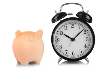 Beige piggy bank and clock isolated on white