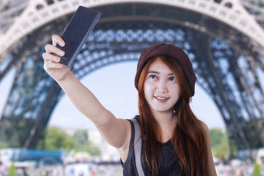 Female traveler taking selfie