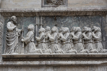 Fototapeta na wymiar Medieval bas-relief, exterior house, Venice