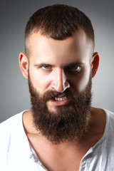 Obraz premium Portrait of handsome man standing, isolated on grey background