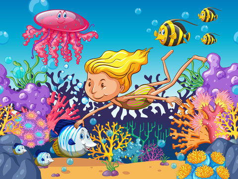 Girl swimming with sea animals underwater