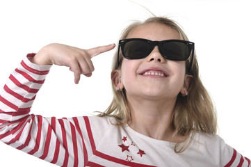 beautiful 6 to 8 years old female child with blond hair wearing big sunglasses smiling happy and playful