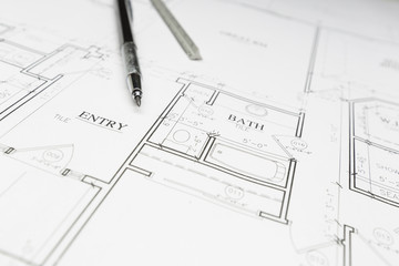 Engineer Pencil and Ruler Resting on House Plans