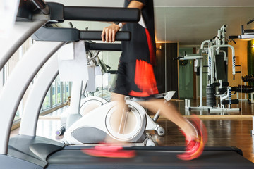 Man exercise on treadmill in fitness gym