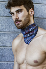 Close up of handsome man with long beard and blue scarf around his neck.  © anderpe