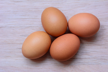 Fresh eggs on wooden background