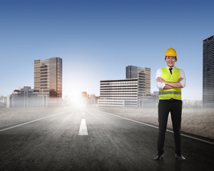 Asian man in safety vest posing