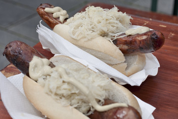 hot dog with mustard and vegetables