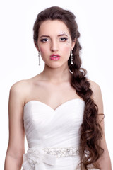 Portrait of beautiful young brunette woman bride  in white Weddi