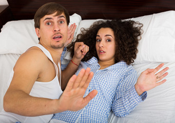 Young adults caught having sex in bed