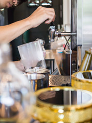 Fototapeta na wymiar close up of barista with siphon coffee maker