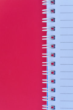 White notebook with vertical red page